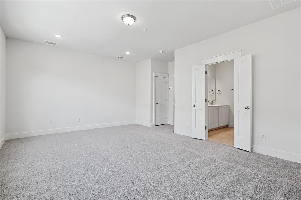 809 Concan Drive Plano, TX 75075 - Photo 19 of 40 Unfurnished bedroom with light carpet and ensuite bath