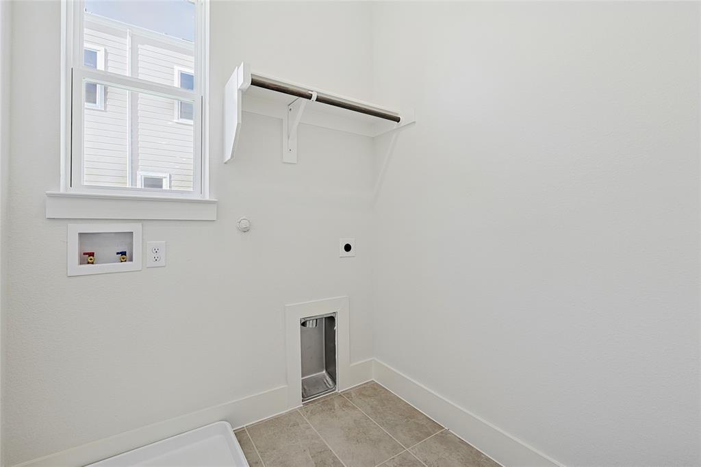 809 Concan Drive Plano, TX 75075 - Photo 40 of 40 Laundry area with washer hookup, gas dryer hookup, hookup for an electric dryer, and light tile patterned floors