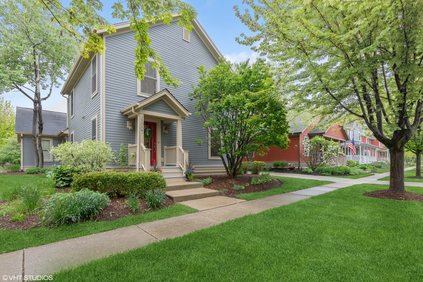 a front view of house with yard and green space