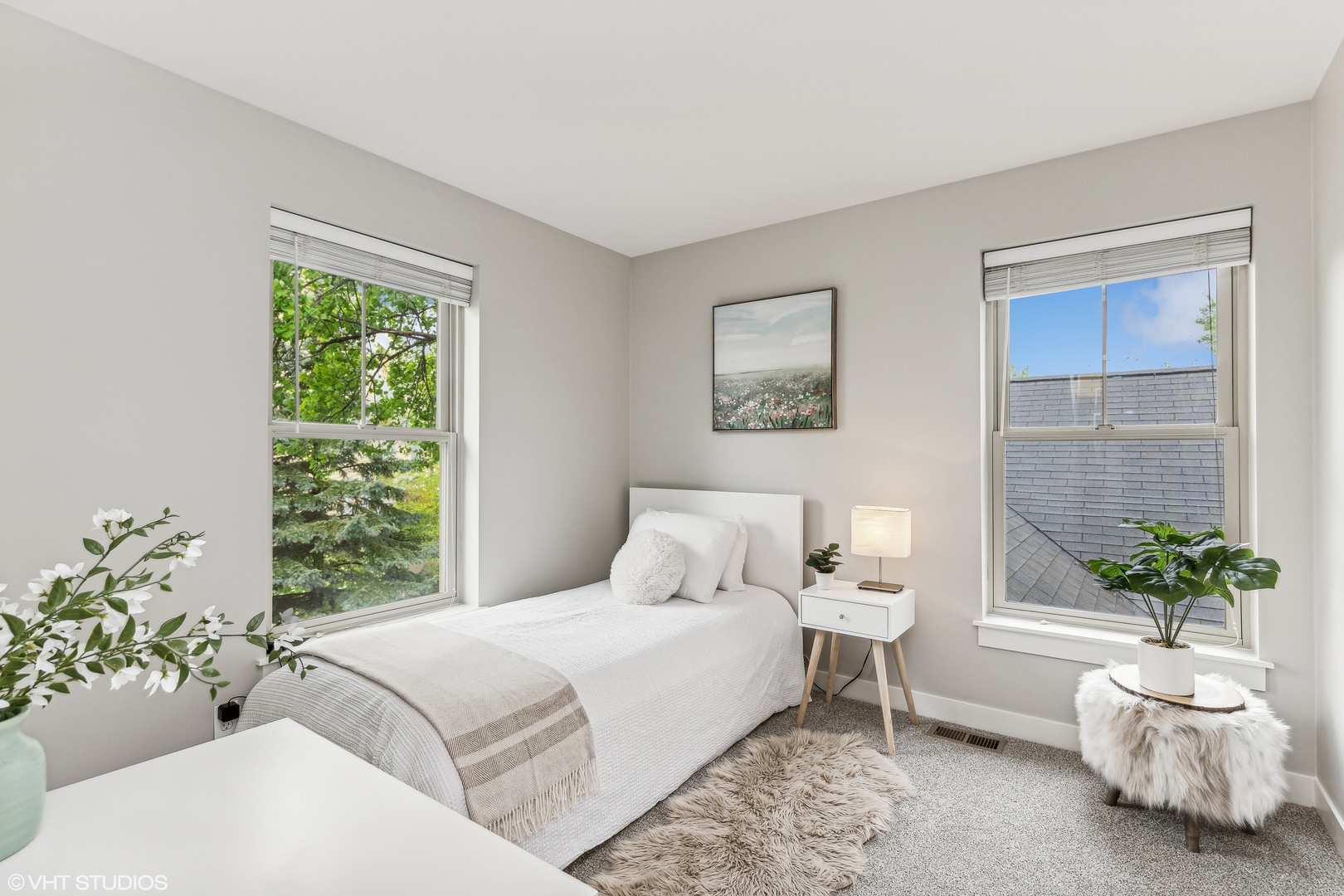 1007 Harris Road Grayslake, IL 60030 - Photo 15 of 32 a bedroom with a large bed and a potted plant