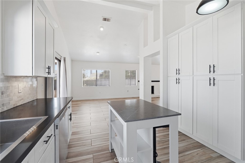 9841 Golden Arrow Lane Rancho Cucamonga, CA 91701 - Photo 15 of 53 a kitchen with stainless steel appliances granite countertop a sink a stove and a refrigerator