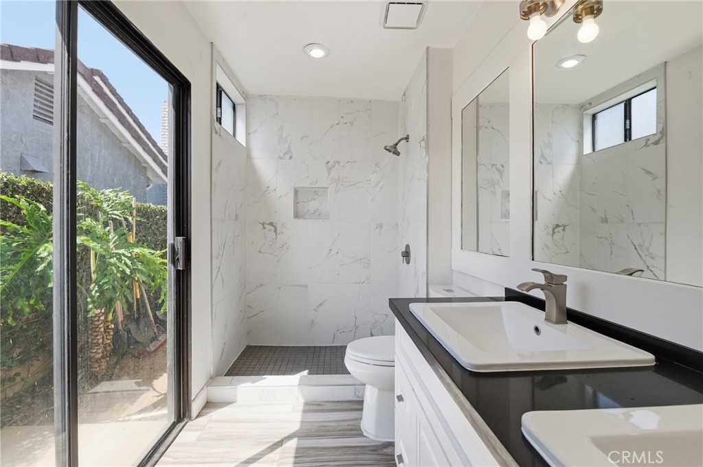 9841 Golden Arrow Lane Rancho Cucamonga, CA 91701 - Photo 19 of 53 a bathroom with a sink and a mirror