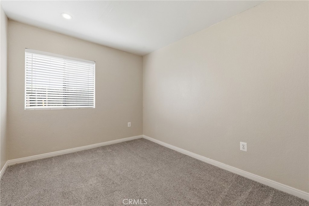 9841 Golden Arrow Lane Rancho Cucamonga, CA 91701 - Photo 24 of 53 an empty room with a window