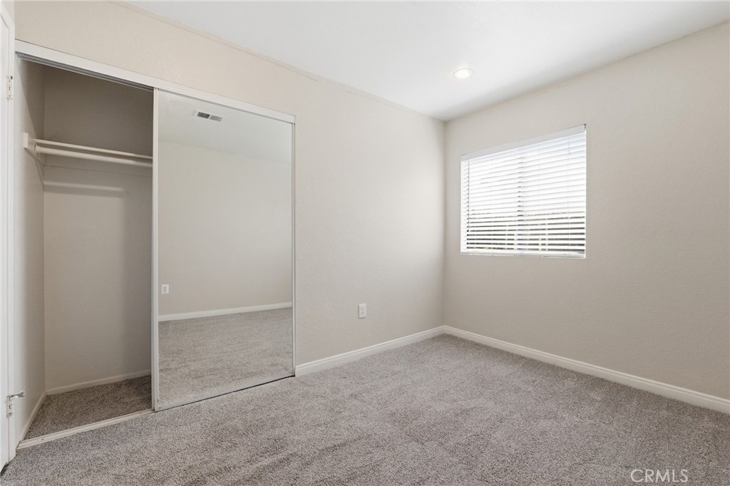 9841 Golden Arrow Lane Rancho Cucamonga, CA 91701 - Photo 26 of 53 an empty room with windows