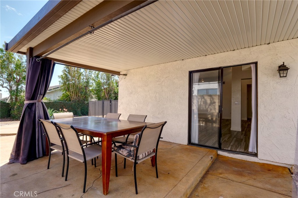 9841 Golden Arrow Lane Rancho Cucamonga, CA 91701 - Photo 30 of 53 a dining room with furniture and window