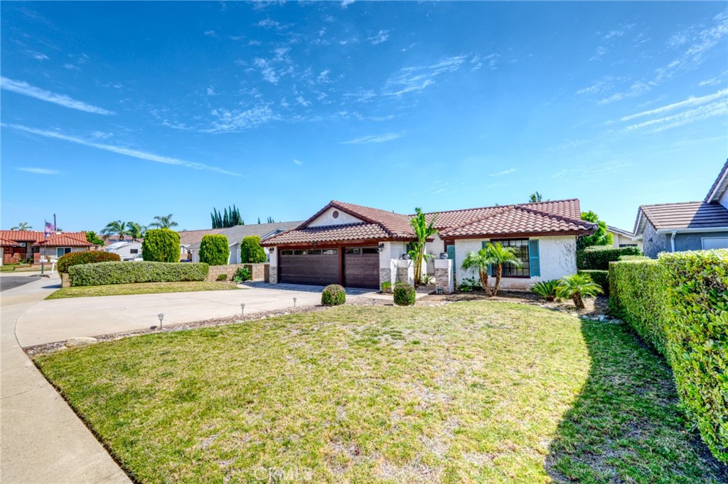 9841 Golden Arrow Lane Rancho Cucamonga, CA 91701 - Photo 35 of 53 a house view with a garden space