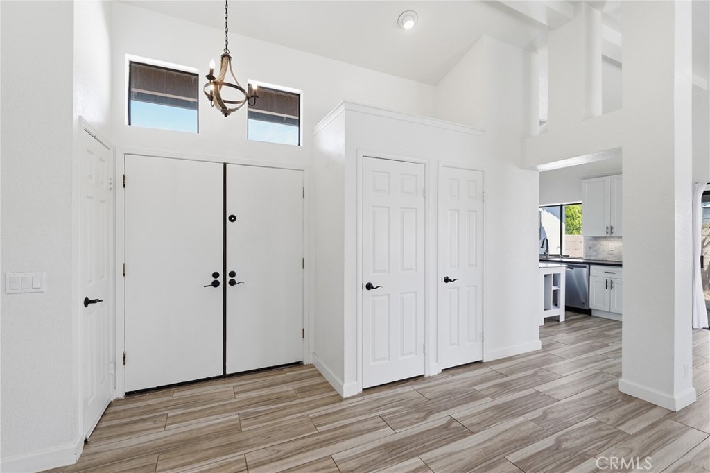 9841 Golden Arrow Lane Rancho Cucamonga, CA 91701 - Photo 4 of 53 a view of empty room with wooden floor