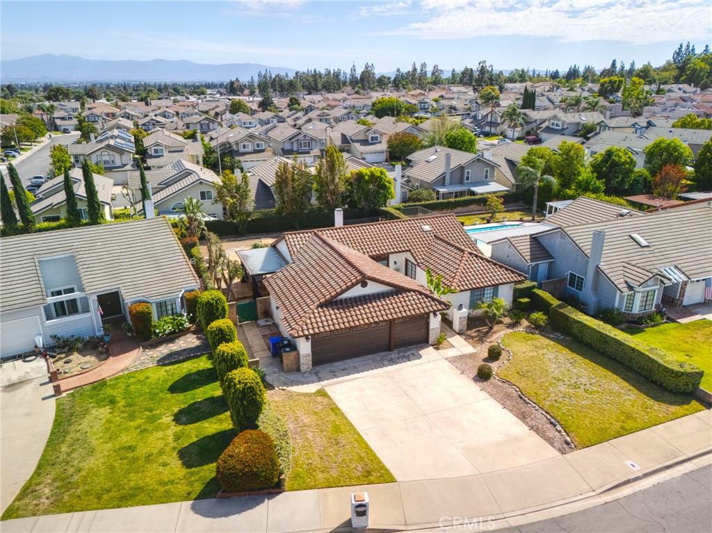 9841 Golden Arrow Lane Rancho Cucamonga, CA 91701 - Photo 42 of 53 an aerial view of a house with a garden and lake view