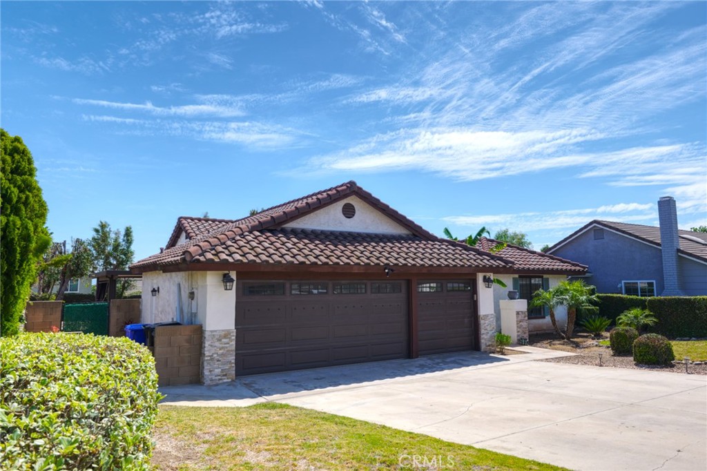 9841 Golden Arrow Lane Rancho Cucamonga, CA 91701 - Photo 43 of 53 a front view of a house with a garage