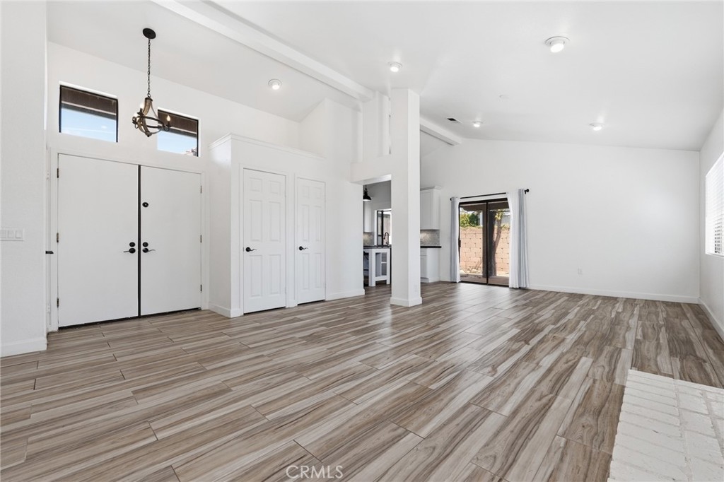 9841 Golden Arrow Lane Rancho Cucamonga, CA 91701 - Photo 6 of 53 a view of an empty room with wooden floor
