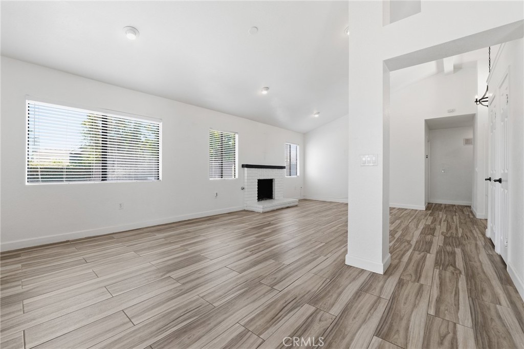 9841 Golden Arrow Lane Rancho Cucamonga, CA 91701 - Photo 8 of 53 a view of empty room with wooden floor and window