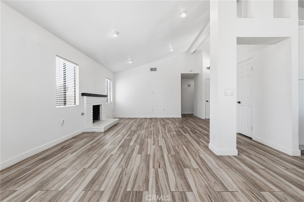 9841 Golden Arrow Lane Rancho Cucamonga, CA 91701 - Photo 9 of 53 a view of empty room with wooden floor and window