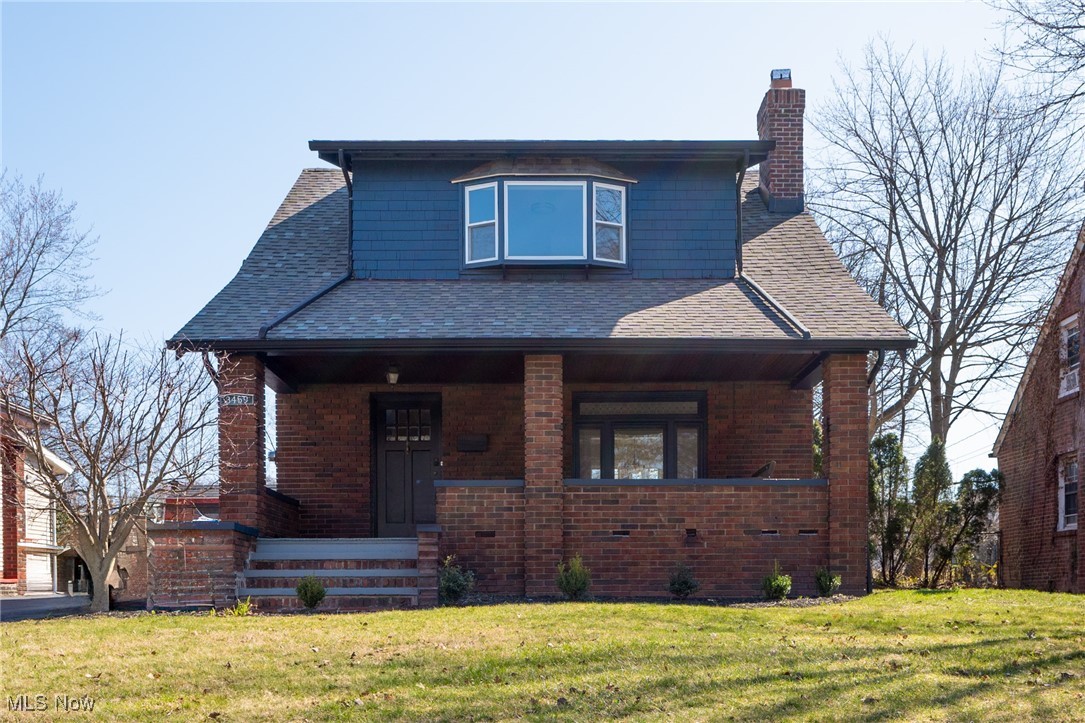 3459 Helen Road Shaker Heights, OH 44122 - Photo 1 of 29 View of front of house with a chimney, brick siding, roof with shingles, and a front lawn
