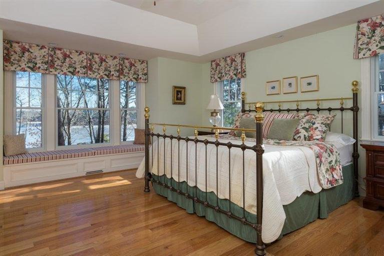 7 Harbor Ridge Road Mashpee, MA 02649 - Photo 21 of 26 a bed sitting in a bedroom next to a window