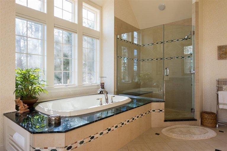 7 Harbor Ridge Road Mashpee, MA 02649 - Photo 22 of 26 a bathroom with a granite countertop tub sink and mirror