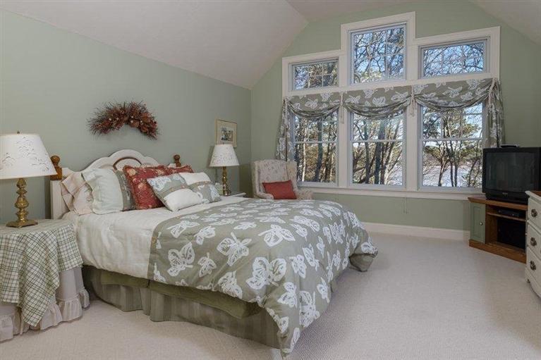 7 Harbor Ridge Road Mashpee, MA 02649 - Photo 23 of 26 a bedroom with a bed and a night stand