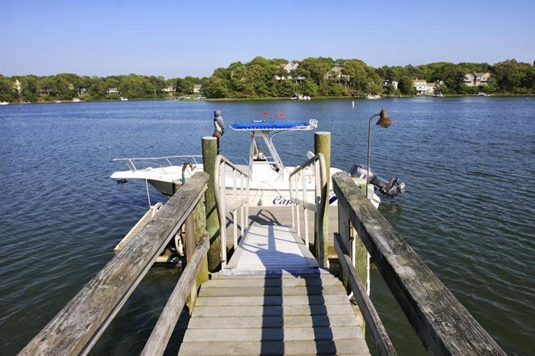 7 Harbor Ridge Road Mashpee, MA 02649 - Photo 7 of 26 a view of a lake with a deck