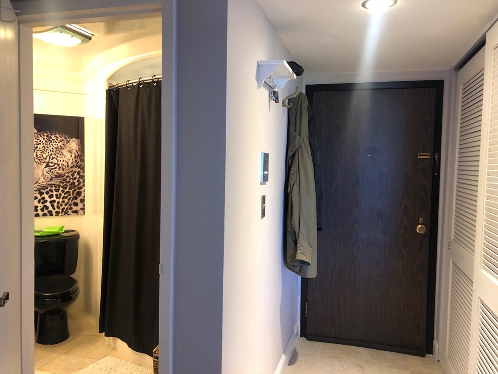 73 Broad Reach, Unit M55C Weymouth, MA 02191 - Photo 8 of 18 a bathroom with a bathtub and a shower