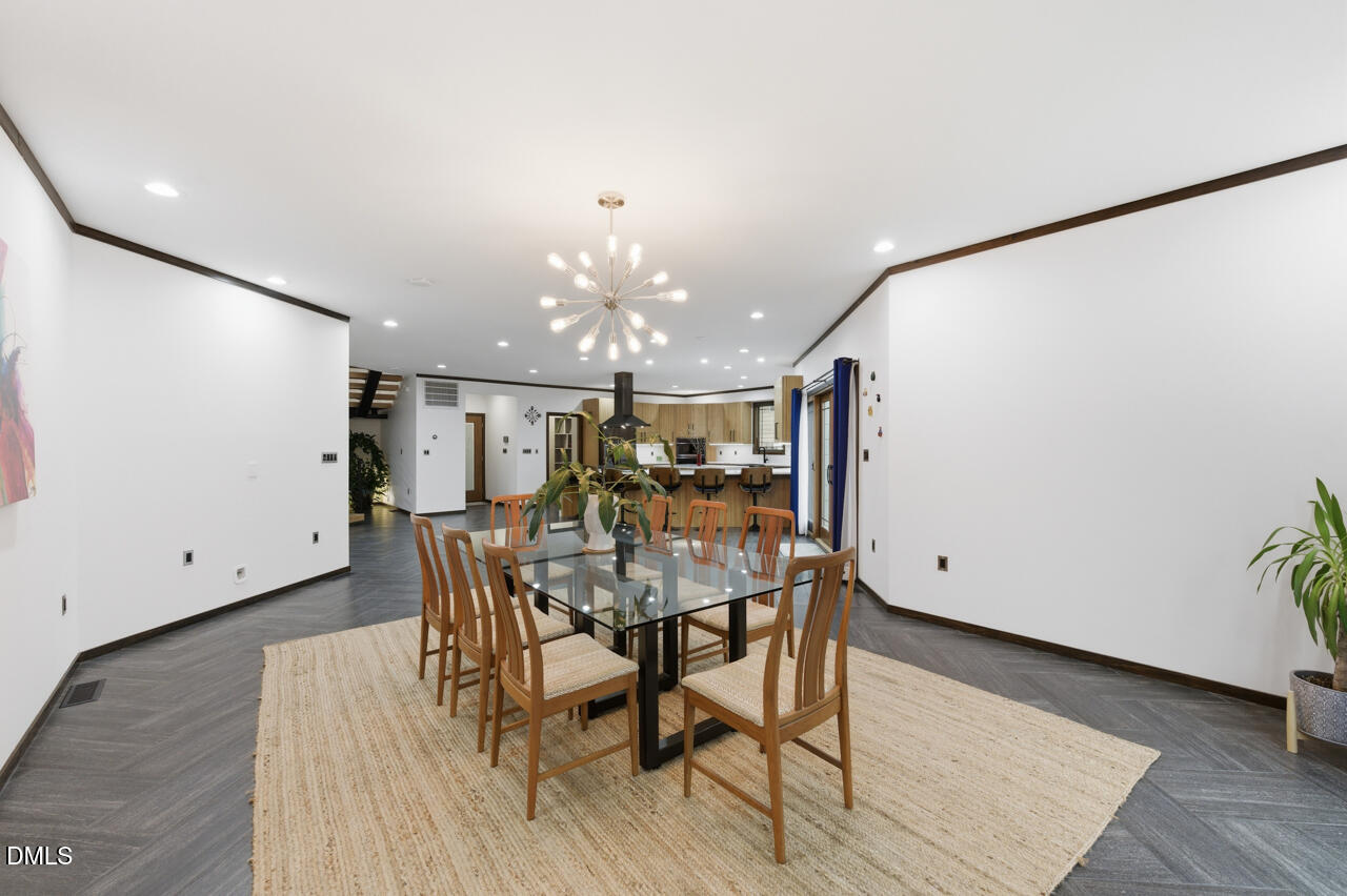 3315 Denada Path Durham, NC 27707 - Photo 24 of 74 a view of a dining room with furniture and wooden floor
