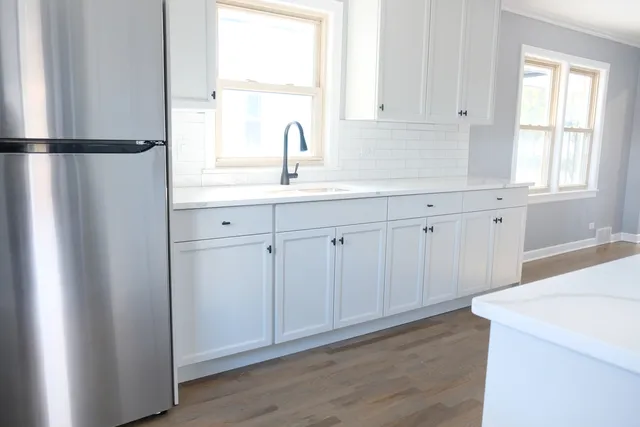 a white toilet sitting next to a bathroom sink