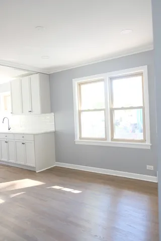 a view of an empty room and a window