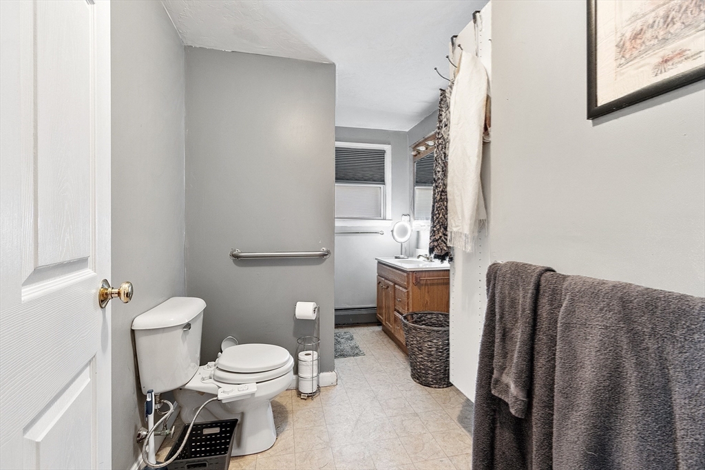 4.5 Old Battery Road Townsend, MA 01474 - Photo 15 of 42 a bathroom with a toilet a sink and mirror