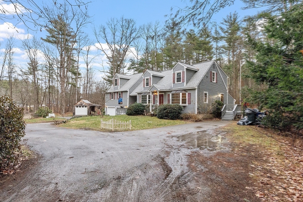 4.5 Old Battery Road Townsend, MA 01474 - Photo 30 of 42 a view of a house with a yard and large trees