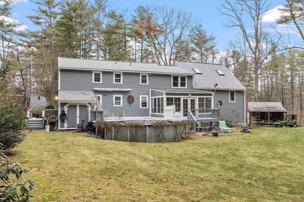 4.5 Old Battery Road Townsend, MA 01474 - Photo 31 of 42 a front view of a house with a yard table and chairs