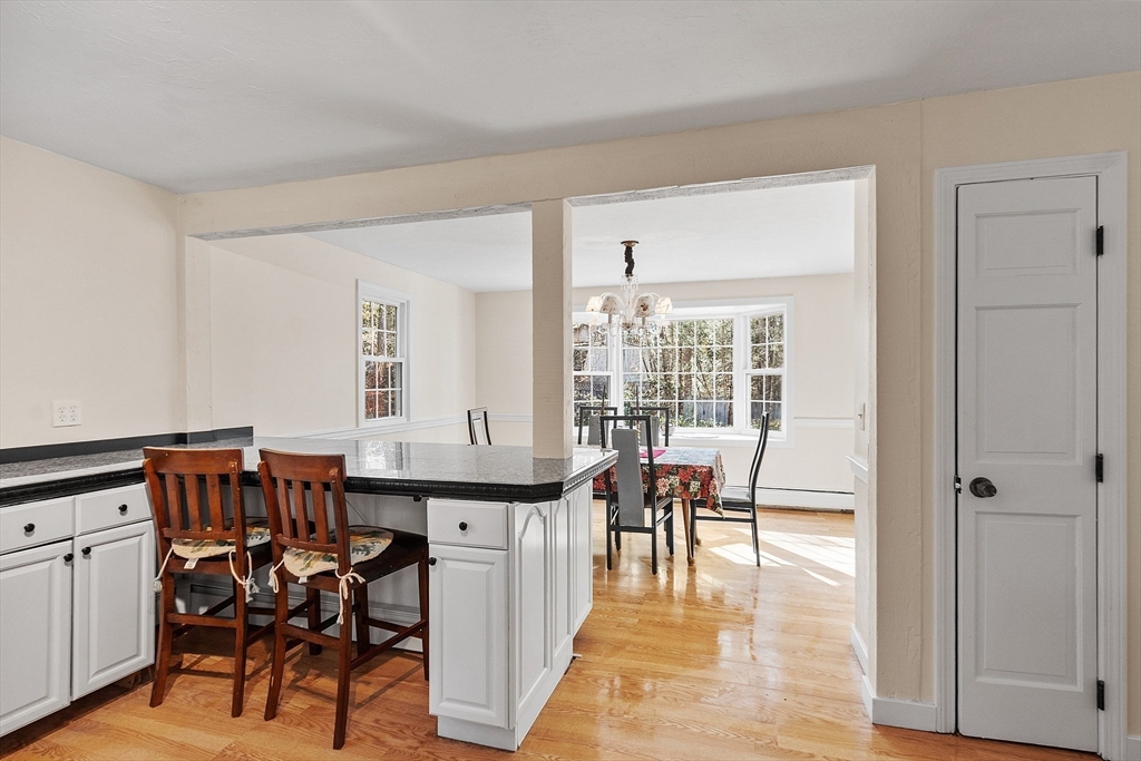 4.5 Old Battery Road Townsend, MA 01474 - Photo 5 of 42 a view of a dining room with furniture and wooden floor