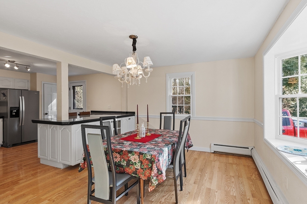 4.5 Old Battery Road Townsend, MA 01474 - Photo 8 of 42 a view of a dining room with furniture and a chandelier