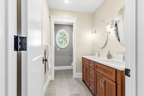 a bathroom with a sink a mirror and a shower