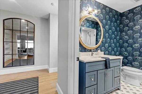 a bathroom with a sink and a mirror