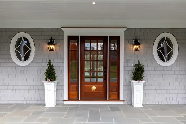 a front view of a house with garden