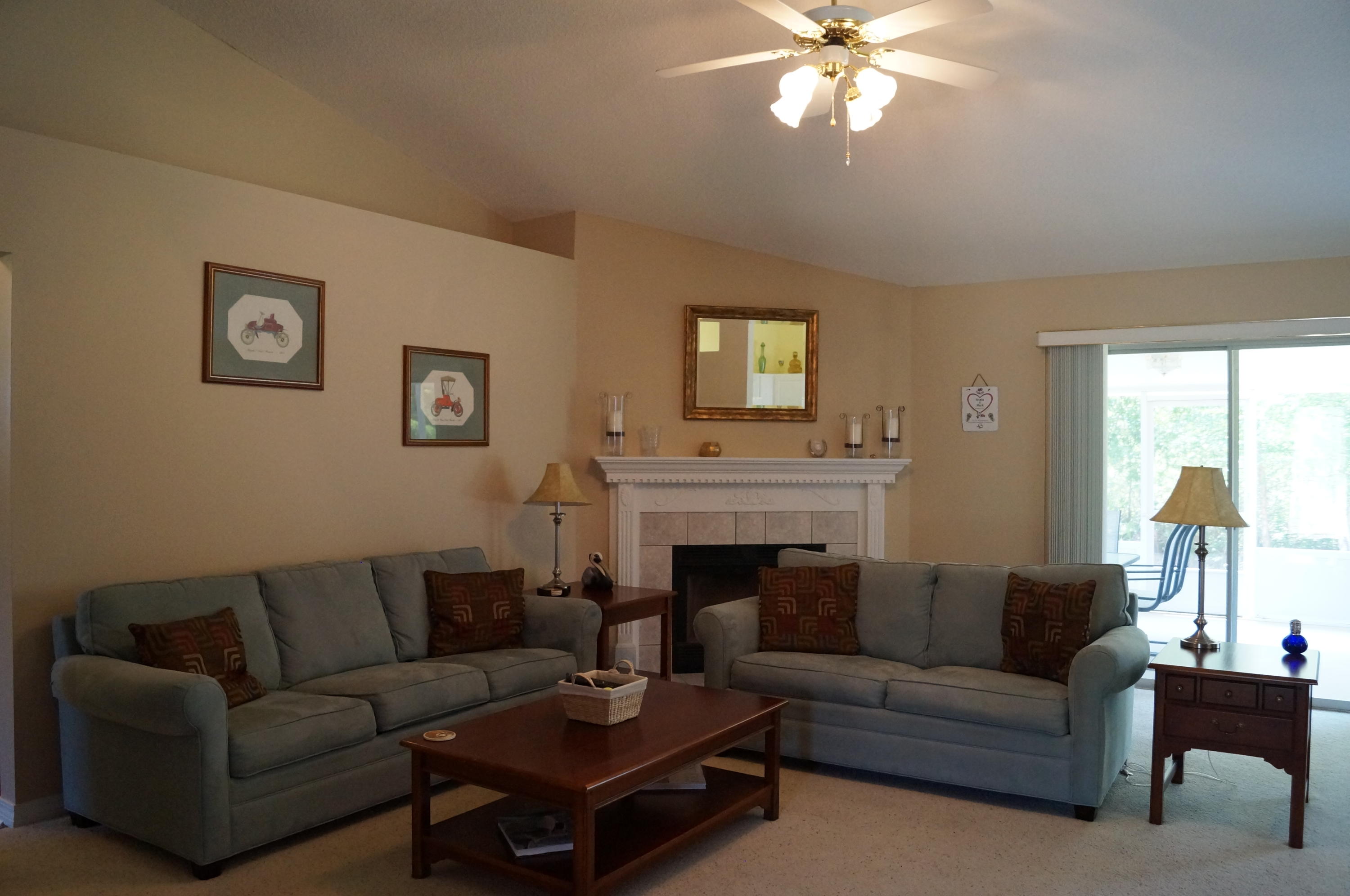 2429 Valley Road Navarre, FL 32566 - Photo 12 of 31 a living room with furniture a fireplace and a window