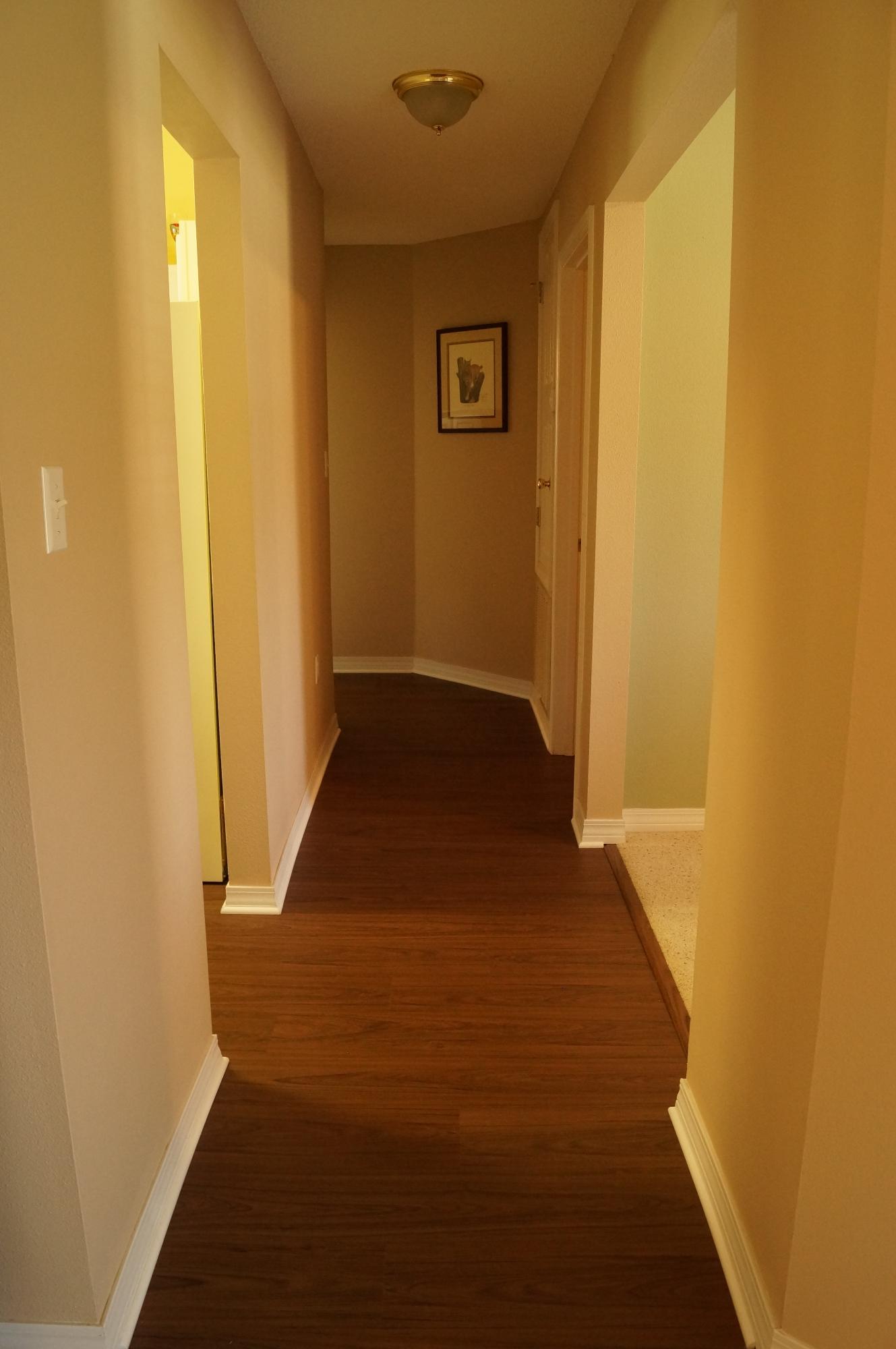 2429 Valley Road Navarre, FL 32566 - Photo 17 of 31 a view of a hallway with wooden floor