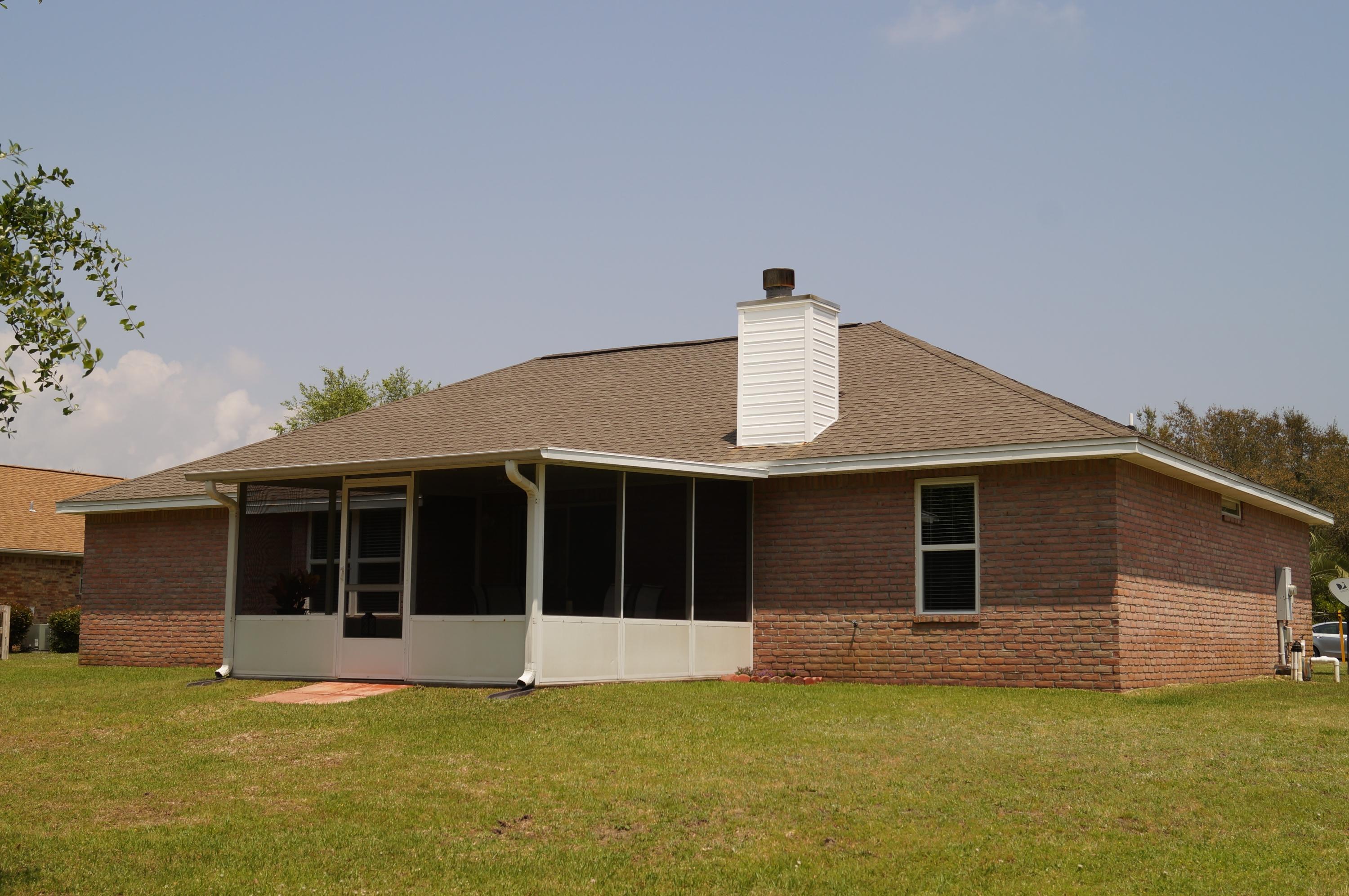 2429 Valley Road Navarre, FL 32566 - Photo 3 of 31 a view of a house with a yard