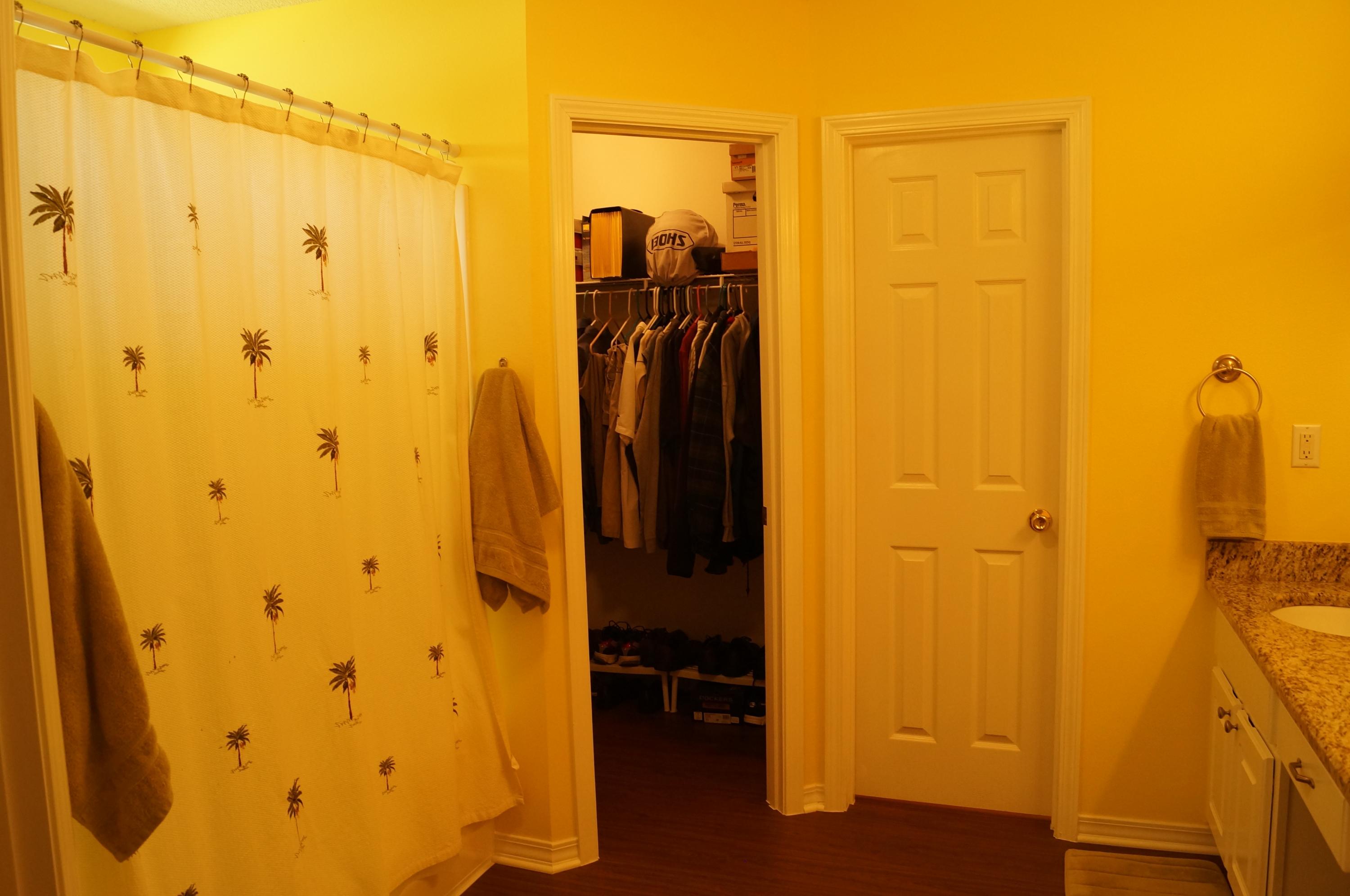 2429 Valley Road Navarre, FL 32566 - Photo 21 of 31 a view of walk in closet with clothes