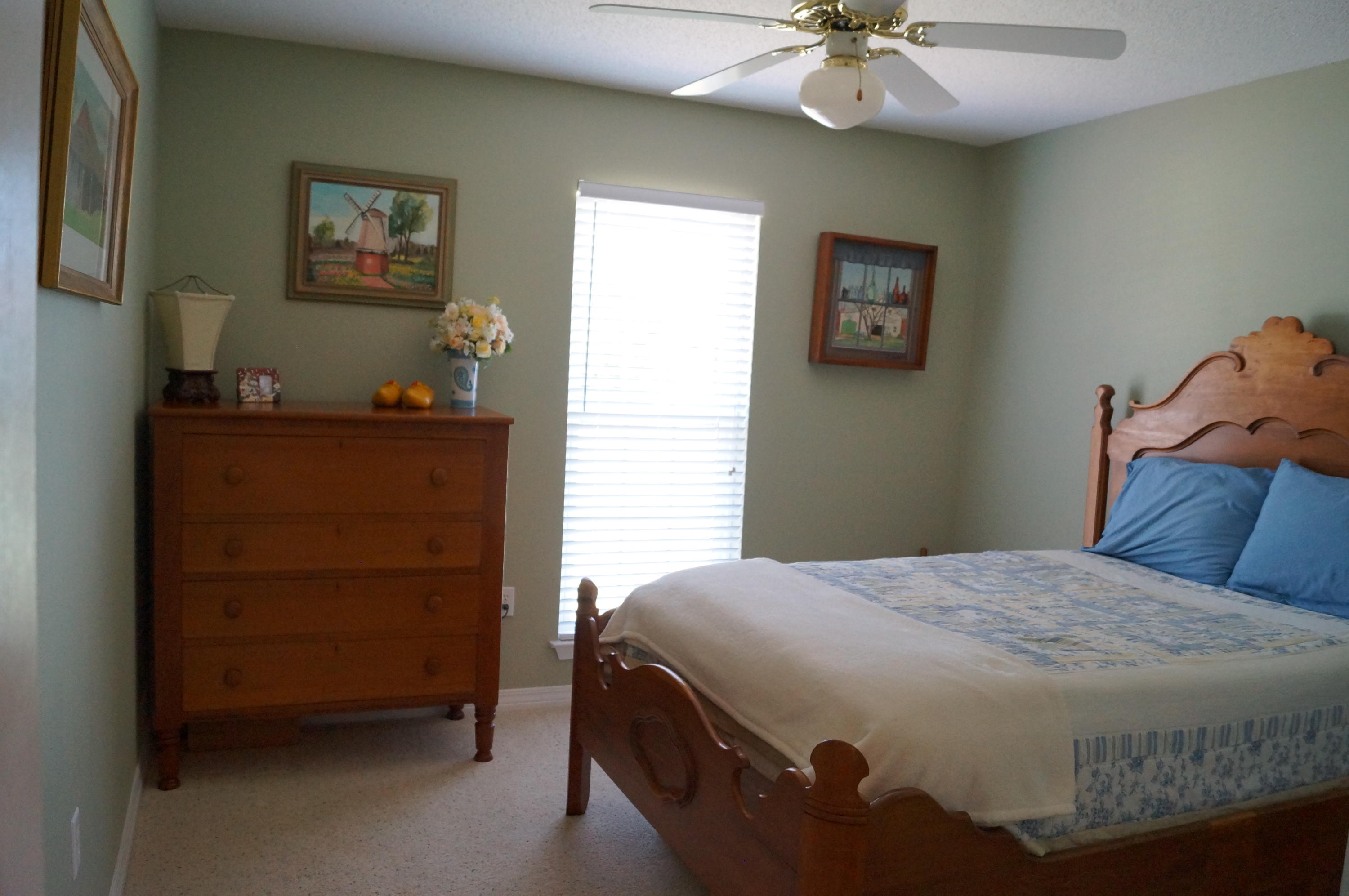 2429 Valley Road Navarre, FL 32566 - Photo 25 of 31 a bedroom with a bed and a chandelier