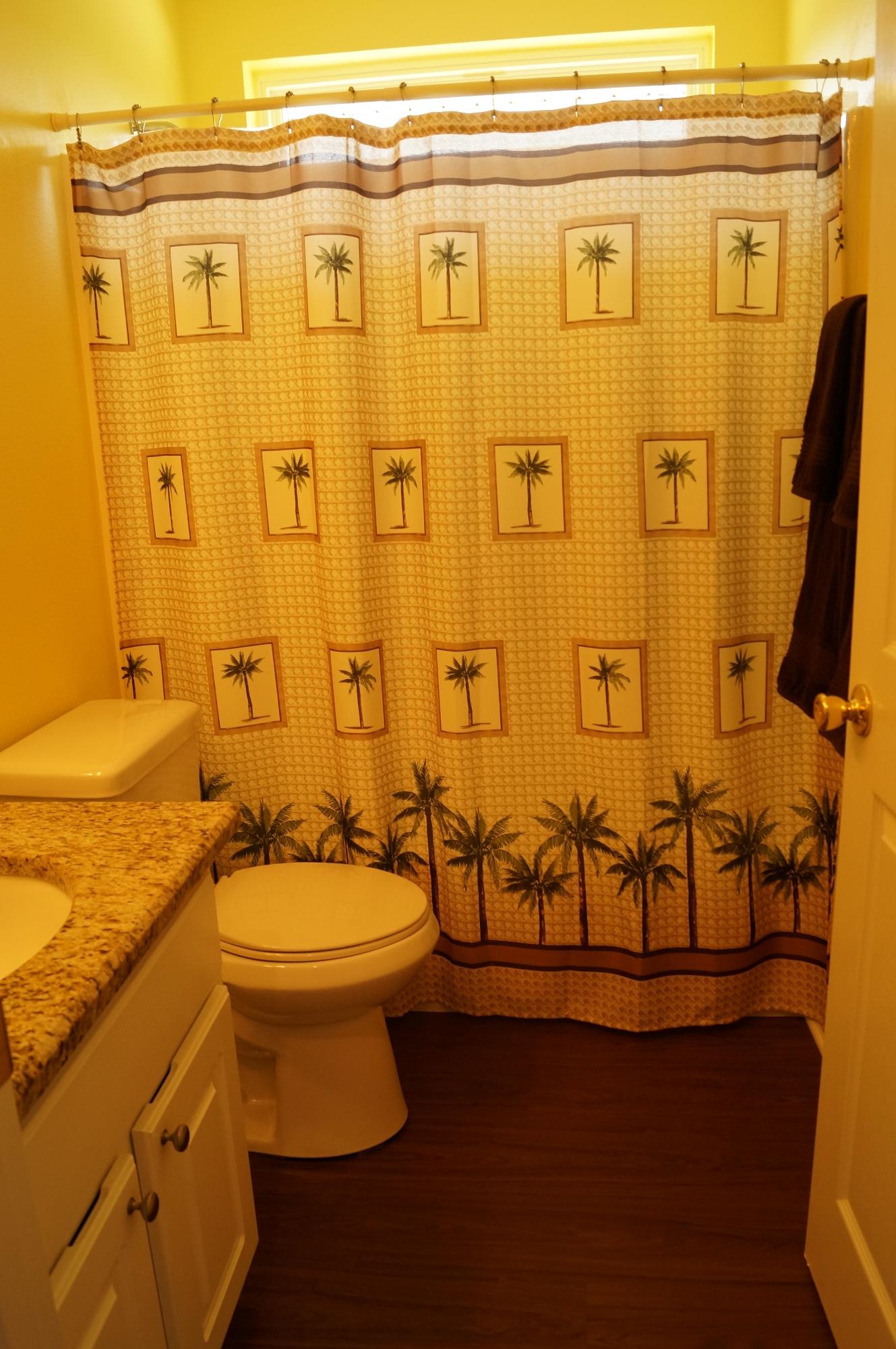 2429 Valley Road Navarre, FL 32566 - Photo 27 of 31 a bathroom with a toilet sink and shower