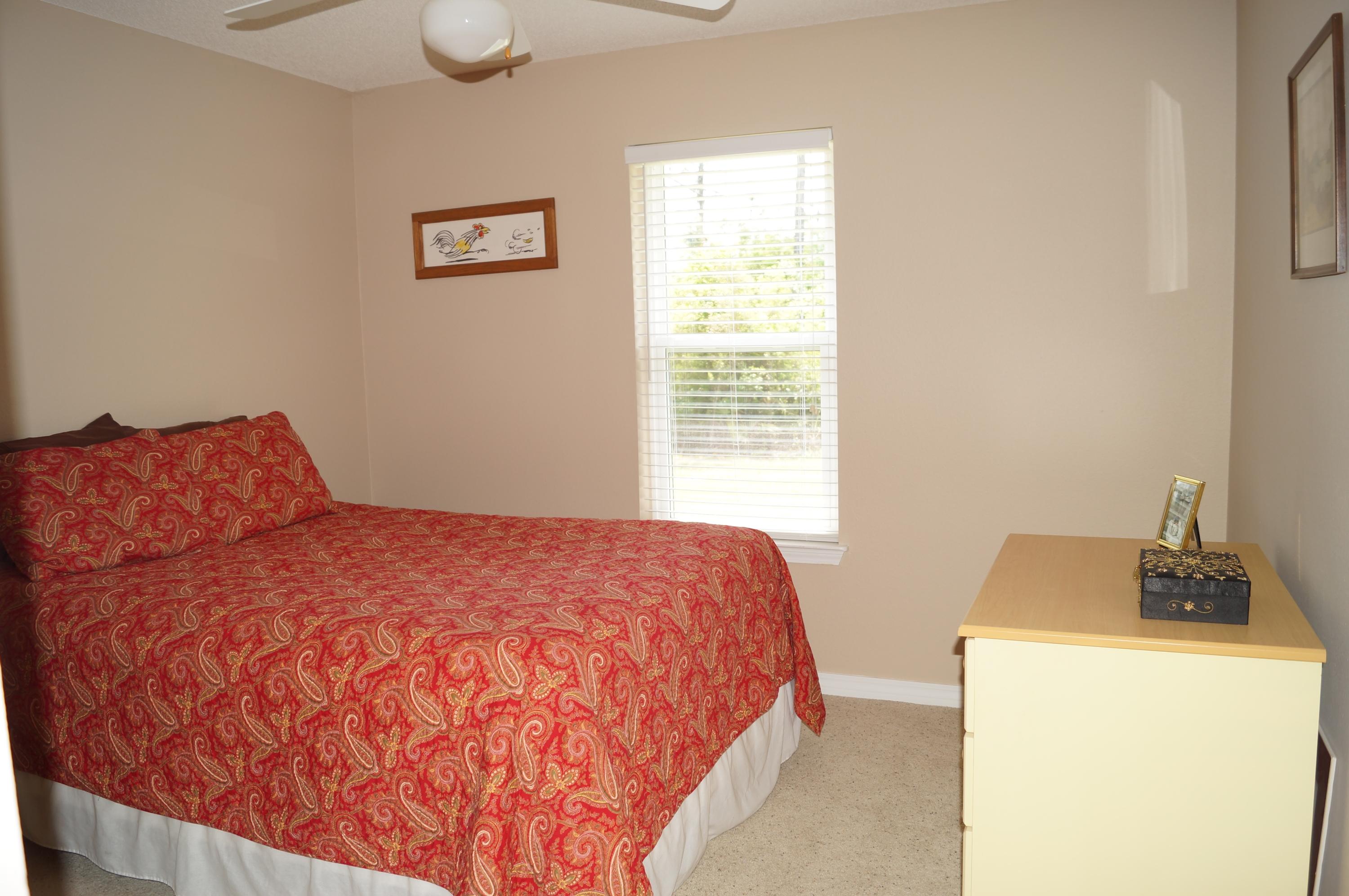 2429 Valley Road Navarre, FL 32566 - Photo 29 of 31 a bedroom with a bed and a window