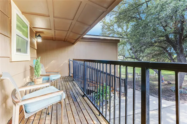 a view of a hallway with a livingroom and couch
