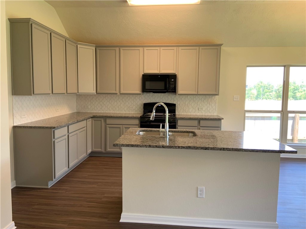 139 Bates Court Huntsville, TX 77320 - Photo 11 of 21 a kitchen with a sink and cabinets