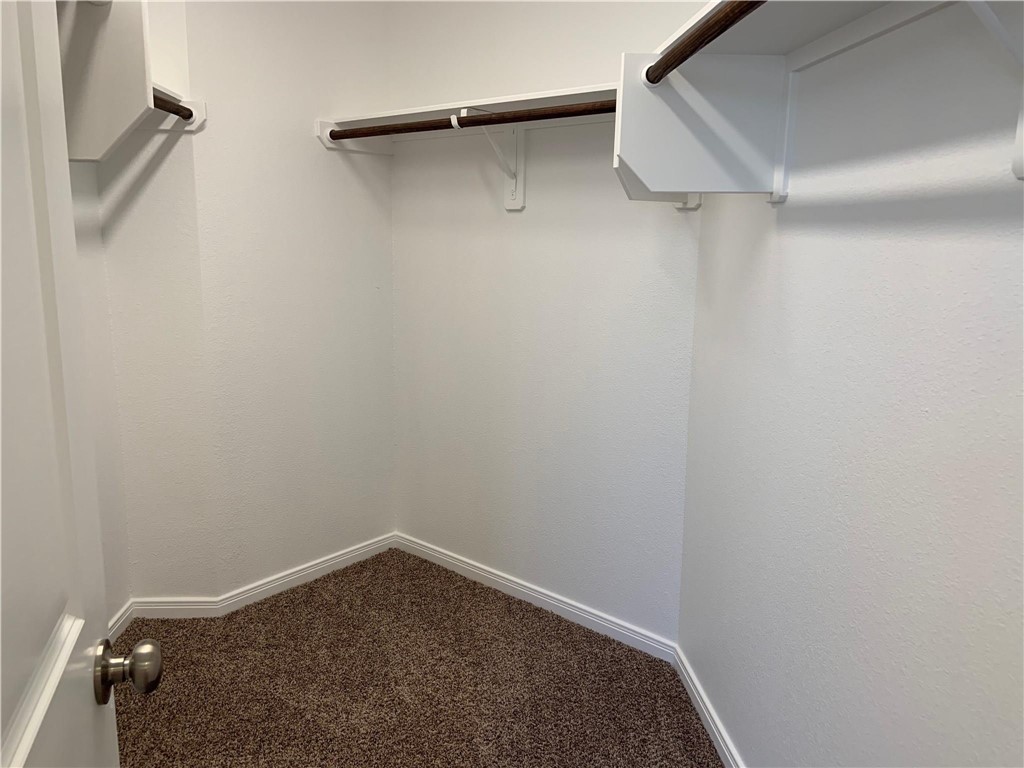 139 Bates Court Huntsville, TX 77320 - Photo 15 of 21 a view of small space with racks on the wall