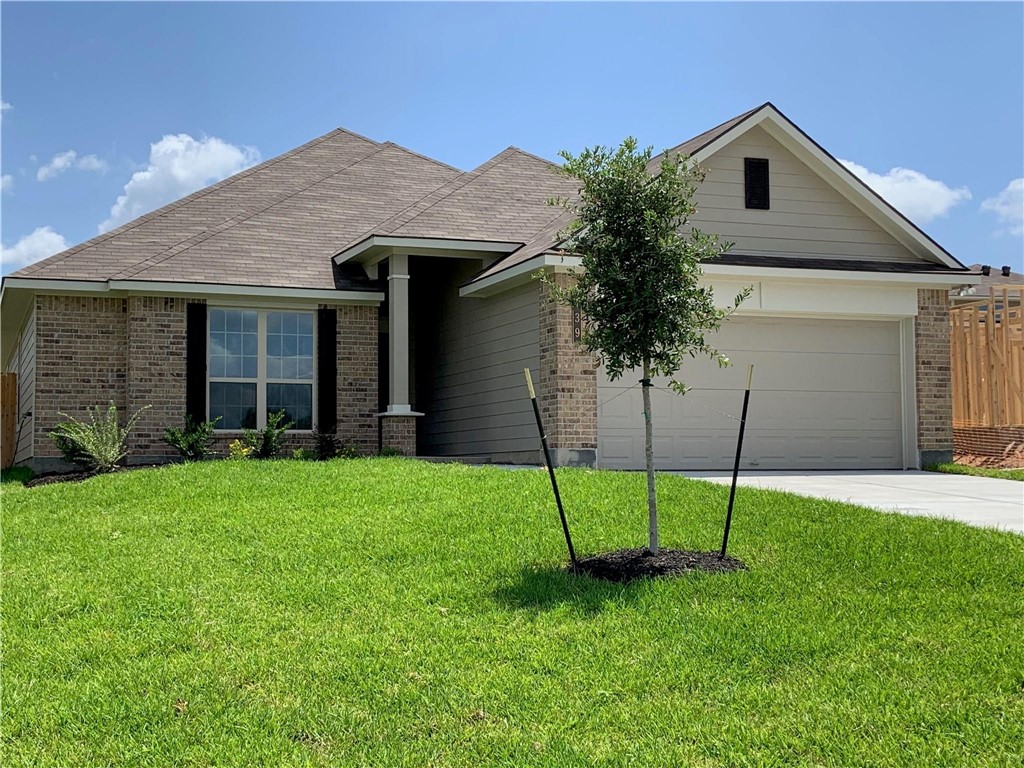 139 Bates Court Huntsville, TX 77320 - Photo 4 of 21 a house that has a garden in front of it