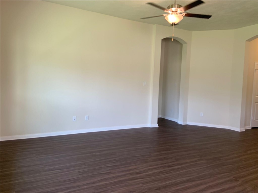 139 Bates Court Huntsville, TX 77320 - Photo 8 of 21 a view of an empty room with wooden floor