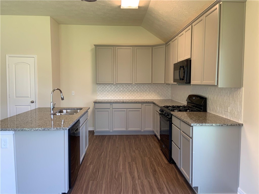 139 Bates Court Huntsville, TX 77320 - Photo 10 of 21 a kitchen with a sink stove and cabinets