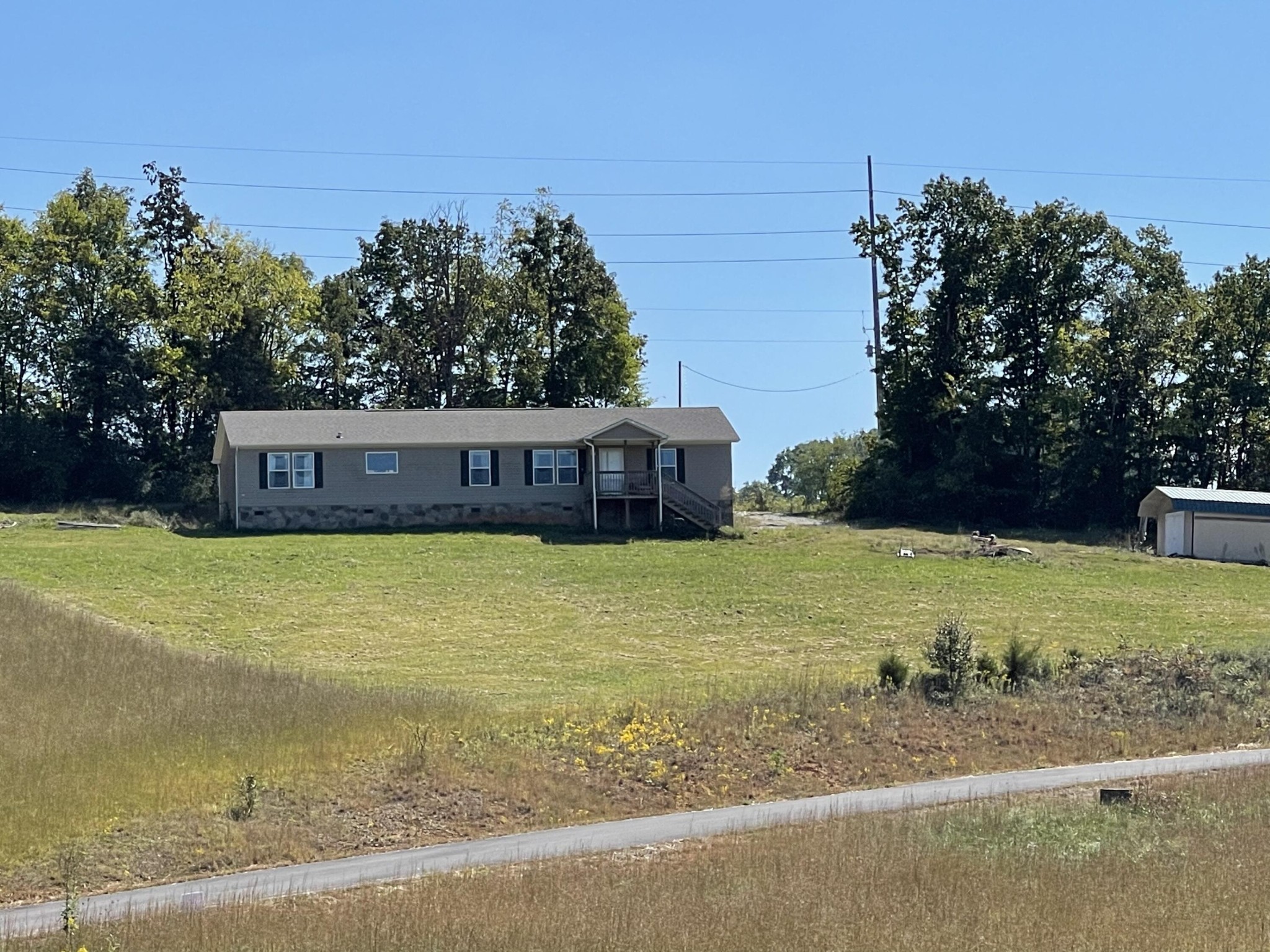 1865 O'Neil Road Newport, TN 37821 - Photo 2 of 19 a front view of a house with a yard and trees