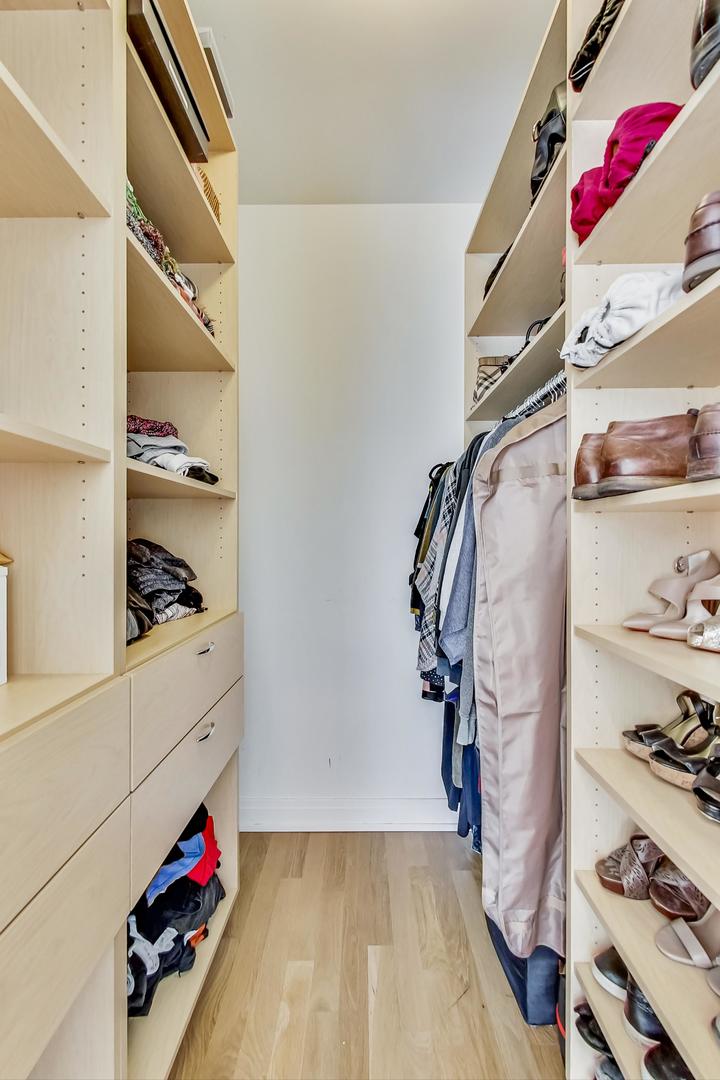 1525 West Fry Street, Unit 2 Chicago, IL 60642 - Photo 14 of 33 a view of walk in closet with clothes and shoes