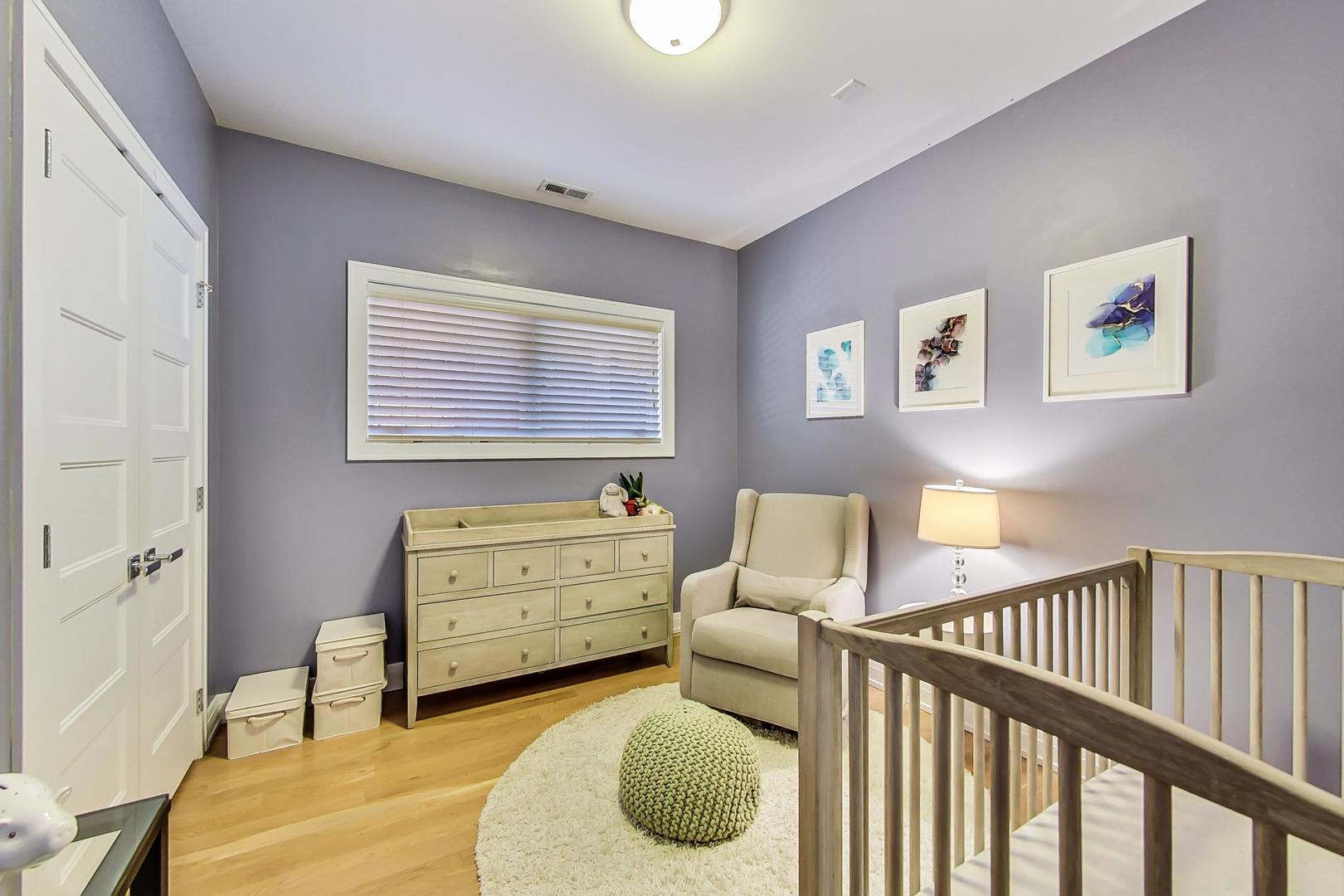 1525 West Fry Street, Unit 2 Chicago, IL 60642 - Photo 17 of 33 a bedroom with a bed and a window