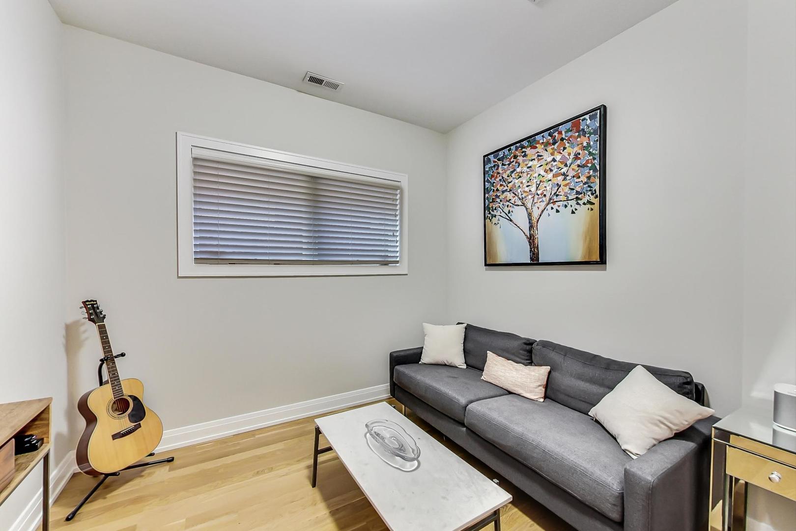 1525 West Fry Street, Unit 2 Chicago, IL 60642 - Photo 19 of 33 a living room with furniture and a window
